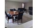 Spacious living room with a dining area, featuring comfortable leather furniture at 10523 Dark Star Dr, Indianapolis, IN 46234
