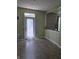 A room with tile floors, green walls, and a door with a curtain at 10523 Dark Star Dr, Indianapolis, IN 46234