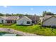 Backyard view of home near waterway. Deck, patio, and green space shown at 10938 E Mount Vernon N Trl, Indianapolis, IN 46229