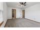 The spacious bedroom includes fresh paint, new carpet, and easy access to the hallway and en-suite bathroom at 10938 E Mount Vernon N Trl, Indianapolis, IN 46229