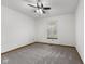 A cozy bedroom featuring neutral carpet, light walls, and a ceiling fan for added comfort at 10938 E Mount Vernon N Trl, Indianapolis, IN 46229