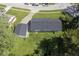 Aerial shot of the house, showing a well-maintained backyard, attached garage, and mature trees at 11 Sayre Dr, Greenwood, IN 46143