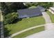 Aerial shot of a home with a spacious yard, an attached garage, and a long driveway at 11 Sayre Dr, Greenwood, IN 46143