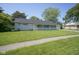 Charming home featuring a well-maintained lawn, inviting front porch, and an attached garage at 11 Sayre Dr, Greenwood, IN 46143