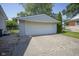 Spacious detached two-car garage with a concrete driveway and ample parking at 11 Sayre Dr, Greenwood, IN 46143