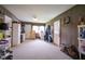 Cozy living room with carpet, lots of storage space, and plenty of natural light at 11 Sayre Dr, Greenwood, IN 46143