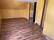 Bright bedroom with wood-look floors, closet, and ample natural light at 1163 Groff Ave, Indianapolis, IN 46222