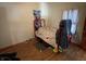 Cozy bedroom with a twin bed, wood-look flooring, and a neutral color scheme, ready for personalization at 1163 Groff Ave, Indianapolis, IN 46222