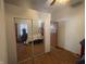 Bedroom featuring a mirrored closet, neutral walls, and wood-look floors, providing a blank canvas for your decor at 1163 Groff Ave, Indianapolis, IN 46222