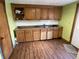 Kitchen with oak cabinets, a double-basin stainless steel sink and ample counter space at 1163 Groff Ave, Indianapolis, IN 46222