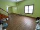 Spacious living room with wood-look floors and ample natural light at 1163 Groff Ave, Indianapolis, IN 46222
