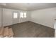 Finished basement area with a bright white walkout and wood-look floors at 12003 Broadway St, Indianapolis, IN 46236