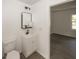 Clean bathroom boasts modern fixtures, decorative mirror, and connects to bedroom at 12003 Broadway St, Indianapolis, IN 46236