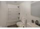 Bright bathroom features a shower-tub combo with modern fixtures, a toilet, and a vanity at 12003 Broadway St, Indianapolis, IN 46236
