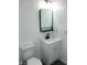 A stylish bathroom featuring modern fixtures, a sleek vanity, and a contemporary mirror at 12003 Broadway St, Indianapolis, IN 46236