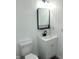 Well-lit bathroom featuring modern fixtures, a sleek vanity, and a contemporary mirror at 12003 Broadway St, Indianapolis, IN 46236