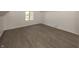 Charming bedroom features gray wood-look flooring and natural light from a window at 12003 Broadway St, Indianapolis, IN 46236