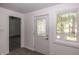 Bright entryway featuring a decorative glass front door and a large window at 12003 Broadway St, Indianapolis, IN 46236