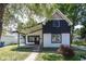 Charming two-story home with a modern black and white exterior at 12003 Broadway St, Indianapolis, IN 46236