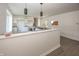 Bright, open kitchen with a bar and white cabinetry at 12003 Broadway St, Indianapolis, IN 46236