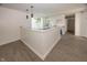 Open kitchen with white cabinets, granite countertops, and stylish pendant lighting at 12003 Broadway St, Indianapolis, IN 46236