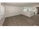 Spacious living room with wood-look floors that opens to the kitchen area at 12003 Broadway St, Indianapolis, IN 46236