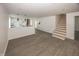 Open living area with staircase and clear view into a modern kitchen at 12003 Broadway St, Indianapolis, IN 46236