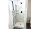 A pristine shower with a mosaic-tiled wall, offering a modern and clean bathing experience at 12003 Broadway St, Indianapolis, IN 46236