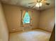 Bedroom featuring neutral carpet, beige walls, ceiling fan, and one window providing natural light at 1219 Lansdowne Rd, Indianapolis, IN 46234