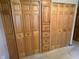 Bedroom closet featuring wood bi-fold doors and built in drawers providing storage space at 1219 Lansdowne Rd, Indianapolis, IN 46234