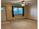 Inviting living room with lots of natural light and neutral carpet throughout the space at 1219 Lansdowne Rd, Indianapolis, IN 46234