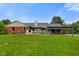 Brick house featuring a large backyard with covered patio and nice landscaping at 12196 N Beth Ann Dr, Camby, IN 46113