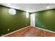 Finished basement room featuring vinyl flooring, fresh paint, and a window at 12196 N Beth Ann Dr, Camby, IN 46113