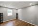 Finished basement room with vinyl flooring, neutral paint, and window with natural light at 12196 N Beth Ann Dr, Camby, IN 46113