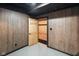 Basement with wood-paneled walls and neutral flooring at 12196 N Beth Ann Dr, Camby, IN 46113