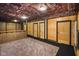 Unique basement space with bar, custom ceiling, multiple doors, and cozy carpet at 12196 N Beth Ann Dr, Camby, IN 46113