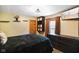 Comfortable bedroom with closet, floating shelves, dresser, and window with views at 12196 N Beth Ann Dr, Camby, IN 46113
