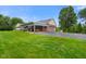 Brick house with large yard and covered patio at 12196 N Beth Ann Dr, Camby, IN 46113
