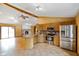Bright kitchen with stainless steel appliances, tile flooring, and an eat-in bar at 12196 N Beth Ann Dr, Camby, IN 46113