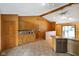 Well-lit kitchen with breakfast bar and tile floors open to adjoining rooms at 12196 N Beth Ann Dr, Camby, IN 46113