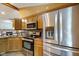 Kitchen with stainless steel appliances and plenty of cabinet space at 12196 N Beth Ann Dr, Camby, IN 46113