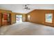 Spacious living room with a ceiling fan, sliding glass door to the patio, and views to the exterior at 12196 N Beth Ann Dr, Camby, IN 46113