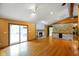 Cozy living room with stone fireplace and sliding glass doors to outdoor patio at 12196 N Beth Ann Dr, Camby, IN 46113
