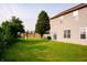 Spacious backyard features lush lawn, mature trees, and a playset, perfect for outdoor activities and Gathering gatherings at 1242 Flatrock Dr, Anderson, IN 46013