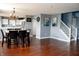 Open concept dining area and kitchen with modern lighting fixtures and neutral paint at 1242 Flatrock Dr, Anderson, IN 46013