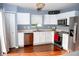 Bright kitchen with white cabinets, stainless steel appliances, and modern fixtures at 1242 Flatrock Dr, Anderson, IN 46013