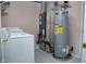 Functional utility room with a water heater and some laundry equipment at 1242 Flatrock Dr, Anderson, IN 46013