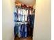 This closet features clothes hanging on a rod, additional items stored on the shelf above at 1242 Flatrock Dr, Anderson, IN 46013