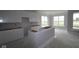Bright kitchen featuring white cabinets and a center island, ideal for cooking and gathering at 12524 Morning Ridge Way, Noblesville, IN 46060