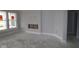 Bright living room with large windows, fresh paint, and baseboards, awaiting personal touches for cozy living at 12524 Morning Ridge Way, Noblesville, IN 46060
